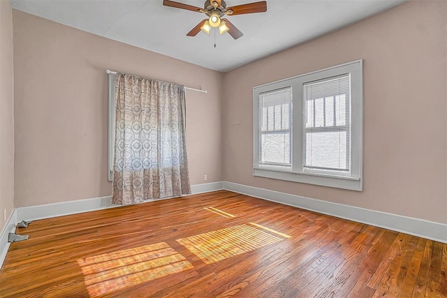 unfurnished room with ceiling fan and wood-type flooring