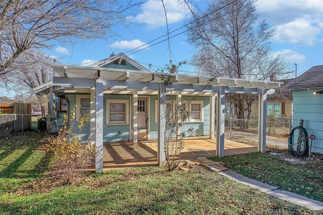 rear view of house featuring a pergola