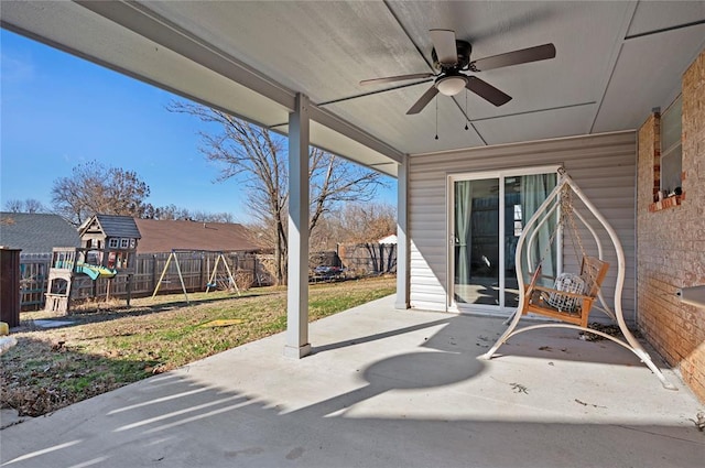 view of patio / terrace featuring a playground and ceiling fan