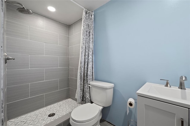 bathroom featuring a shower with curtain, toilet, and vanity