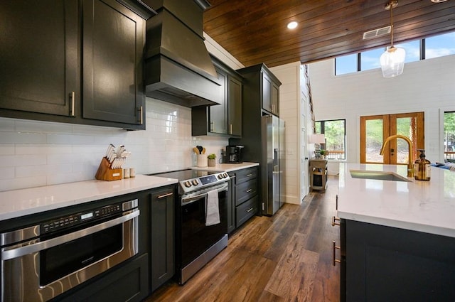 kitchen with premium range hood, wood ceiling, stainless steel appliances, dark wood-type flooring, and decorative light fixtures