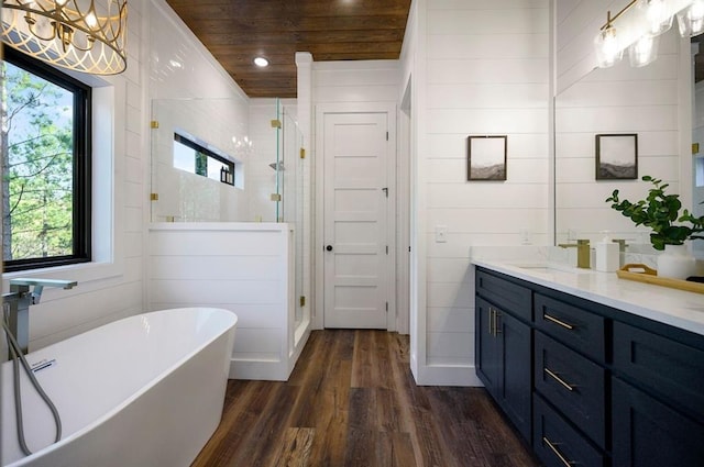 bathroom featuring separate shower and tub, hardwood / wood-style floors, wooden walls, vanity, and wood ceiling