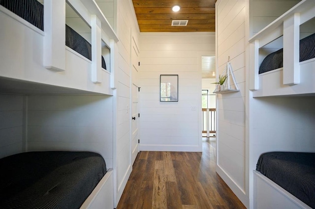 hallway with dark hardwood / wood-style flooring and wood ceiling