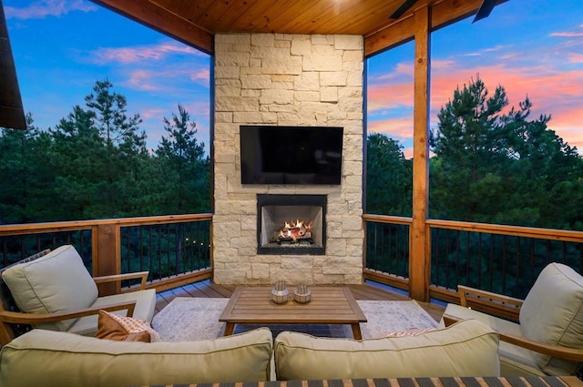 exterior space featuring an outdoor living space with a fireplace