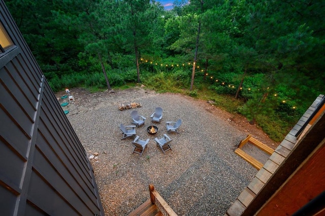 view of yard featuring an outdoor fire pit