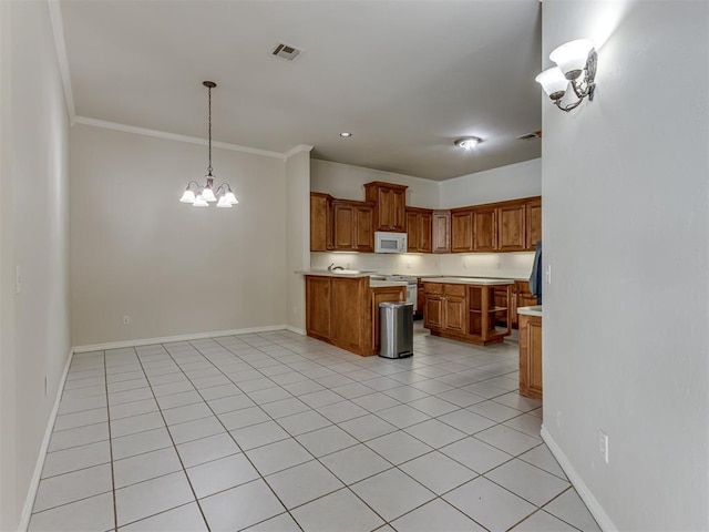 kitchen featuring stainless steel stove, crown molding, pendant lighting, a chandelier, and light tile patterned flooring