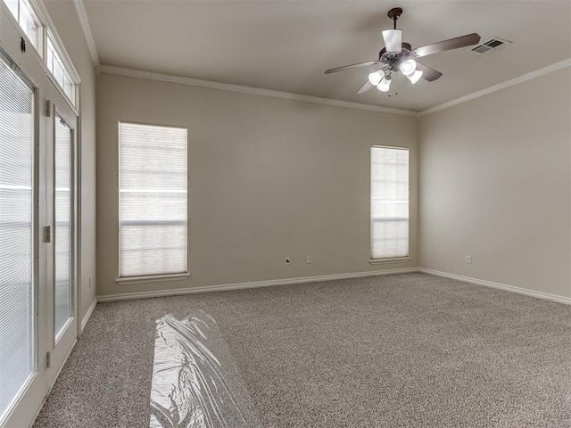 carpeted empty room with ceiling fan and ornamental molding