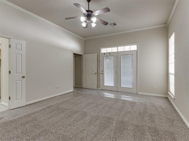 carpeted empty room featuring ceiling fan and ornamental molding