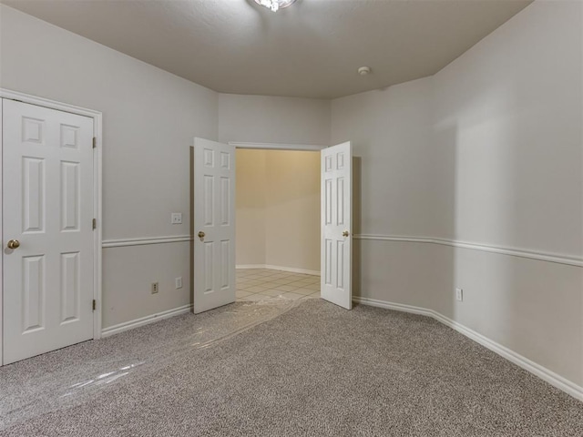 unfurnished bedroom with light carpet