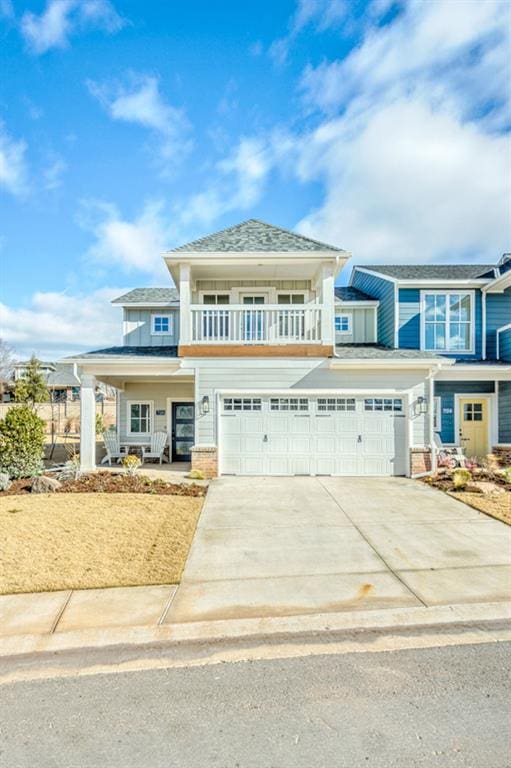 view of front of house with a balcony and a garage