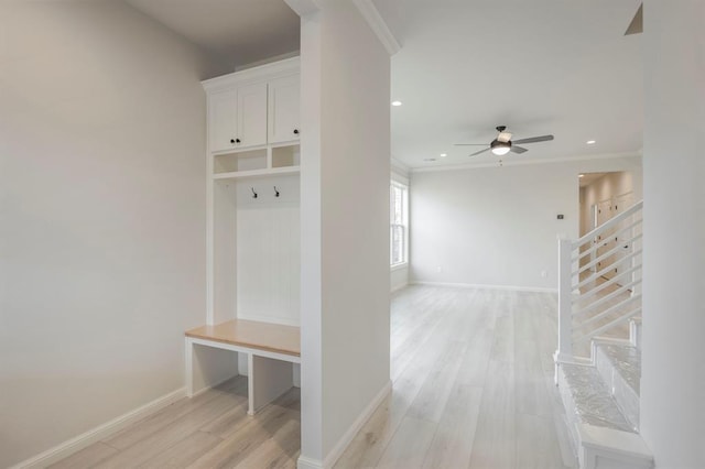 mudroom featuring ceiling fan, crown molding, and light hardwood / wood-style floors