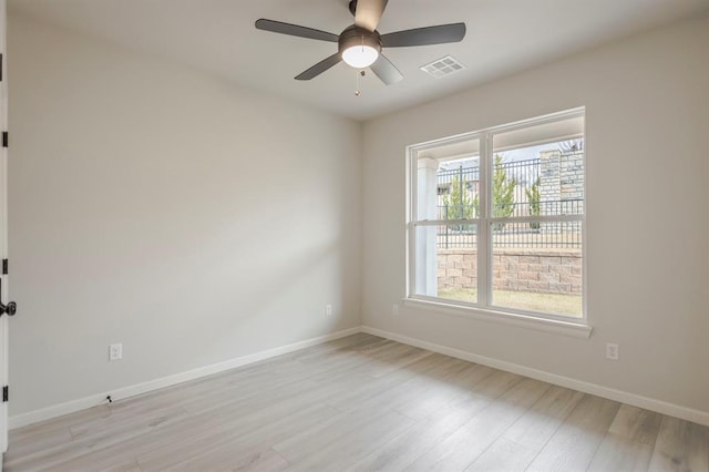 unfurnished room with ceiling fan and light hardwood / wood-style floors