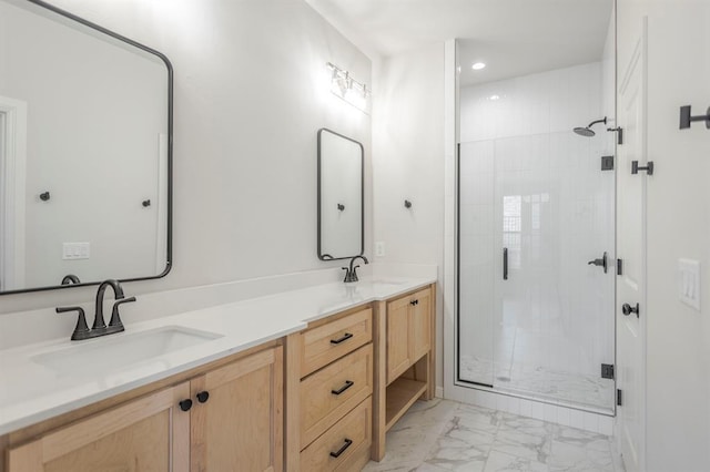 bathroom with a shower with shower door and vanity