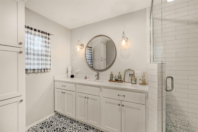 bathroom featuring tile patterned floors, vanity, and an enclosed shower