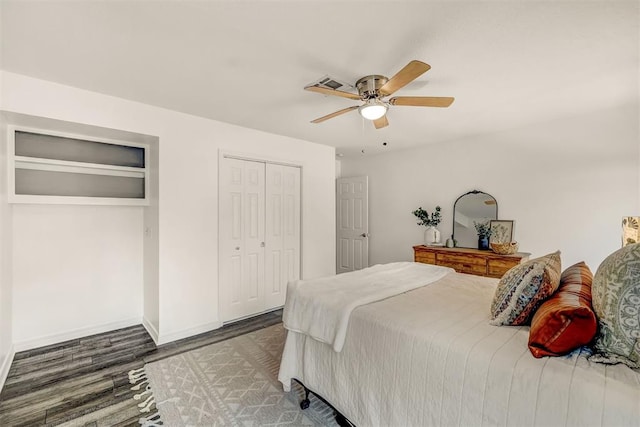 bedroom featuring ceiling fan and dark wood-type flooring