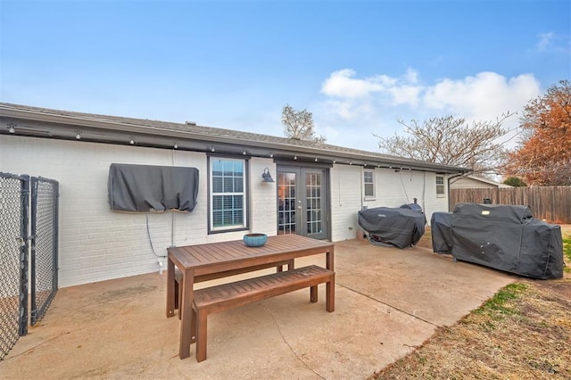 rear view of house featuring a patio area and french doors