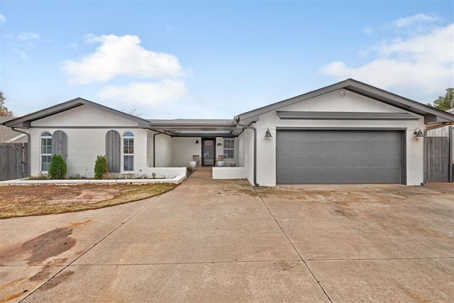 ranch-style house featuring a garage