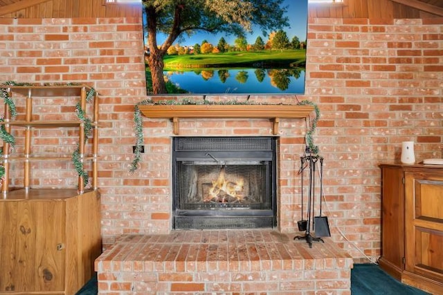 details featuring wood walls and a fireplace