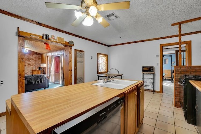 kitchen featuring dishwasher, black range oven, sink, a fireplace, and a textured ceiling