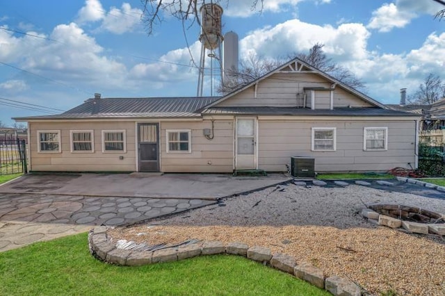 back of property with a patio area and central AC unit