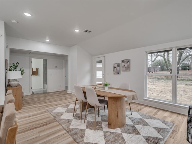 dining room with light wood-type flooring, plenty of natural light, visible vents, and recessed lighting