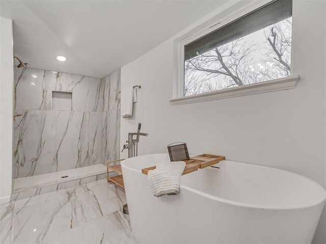 bathroom with marble finish floor, a soaking tub, a marble finish shower, and recessed lighting