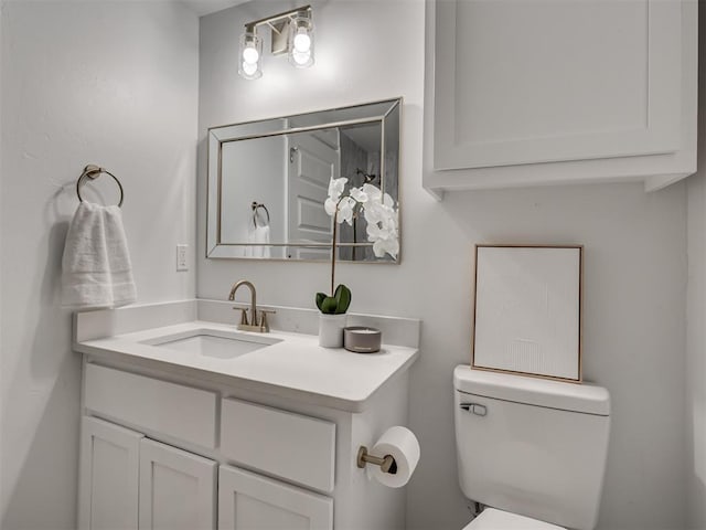 half bath with vanity and toilet