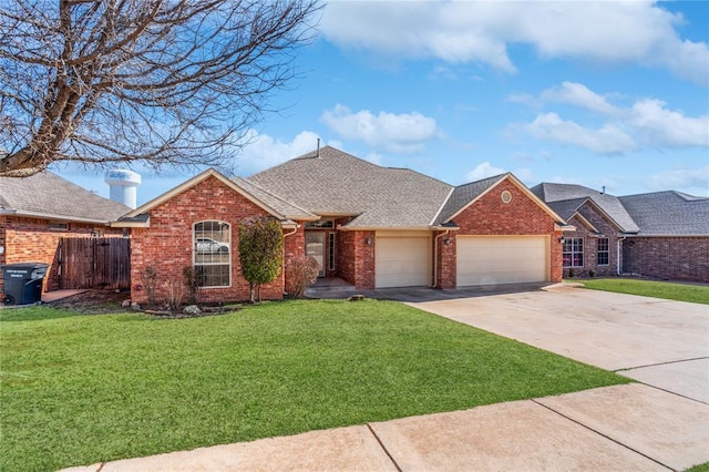 single story home with a garage and a front lawn