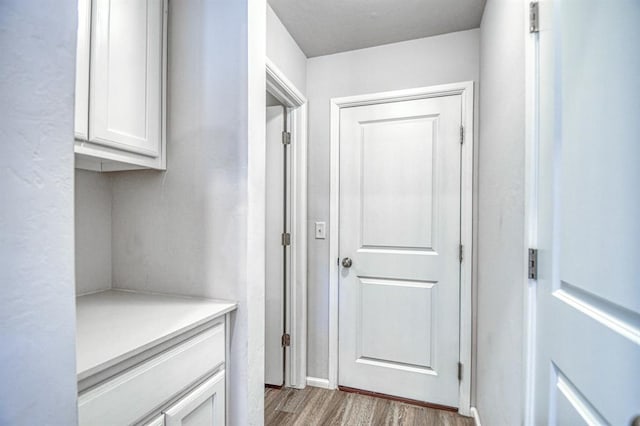 hallway featuring light hardwood / wood-style flooring