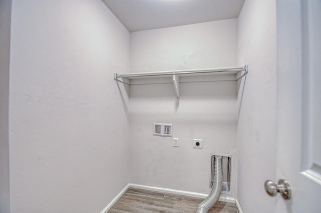 laundry room with hardwood / wood-style floors, hookup for a washing machine, and hookup for an electric dryer