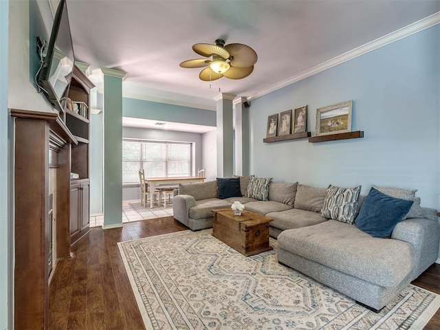 living room with ceiling fan, ornamental molding, and wood-type flooring