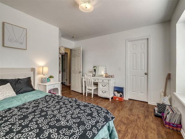 bedroom featuring dark wood-type flooring