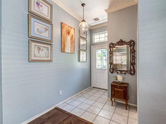 tiled foyer with ornamental molding