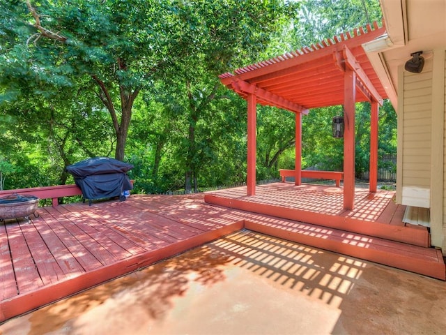 deck featuring a pergola and grilling area