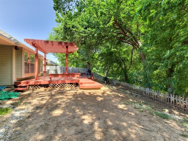 view of yard with a pergola and a deck