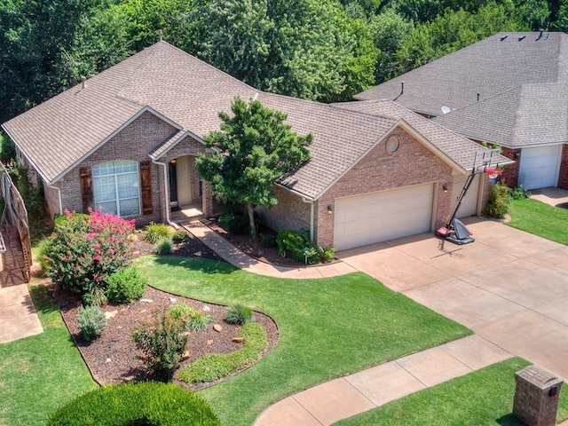 view of front of property with a garage and a front lawn