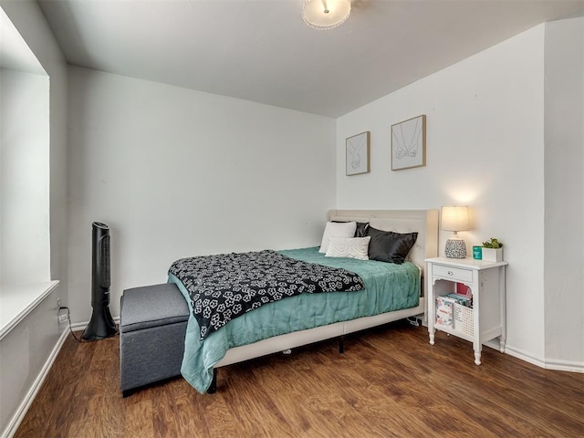 1801 Del Simmons Dr, Edmond, OK 73003 - bedroom with wood finished floors and baseboards