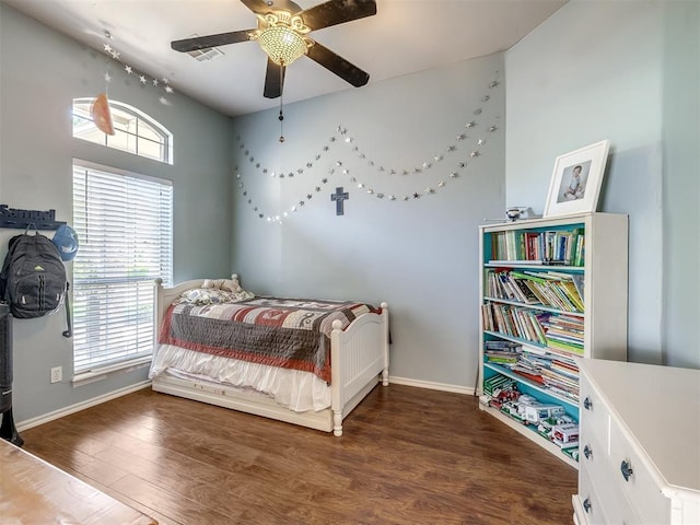 1801 Del Simmons Dr, Edmond, OK 73003 - bedroom with wood finished floors and ceiling fan