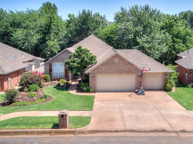 1801 Del Simmons Dr, Edmond, OK 73003 - view of front facade featuring brick siding, a front lawn, driveway, a garage, and a shingled roof