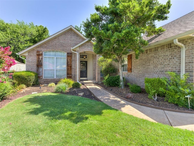 1801 Del Simmons Dr, Edmond, OK 73003 - single story home with brick siding and a front yard