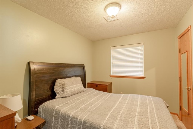 bedroom featuring a textured ceiling