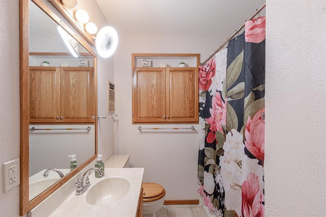 bathroom with tile patterned flooring, vanity, curtained shower, and toilet