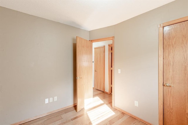 empty room with light wood-type flooring