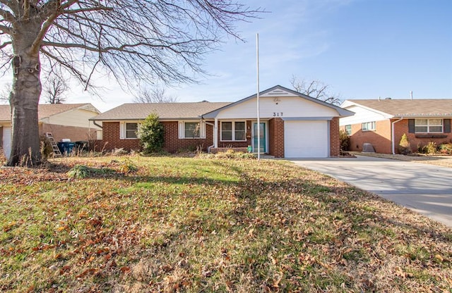 single story home with a front yard and a garage