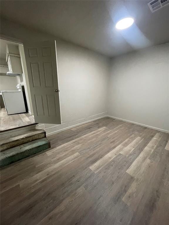 empty room with wood-type flooring