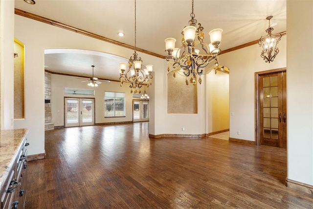 unfurnished living room featuring ornamental molding, dark hardwood / wood-style floors, ceiling fan with notable chandelier, and french doors