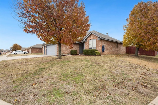 single story home with a garage and a front yard