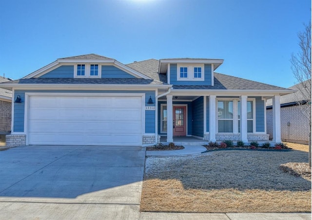 view of front of house featuring a garage and covered porch