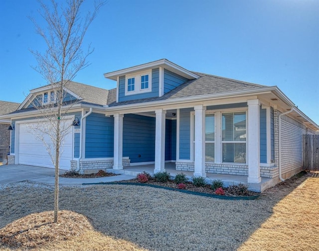 view of front of house with a porch and a garage