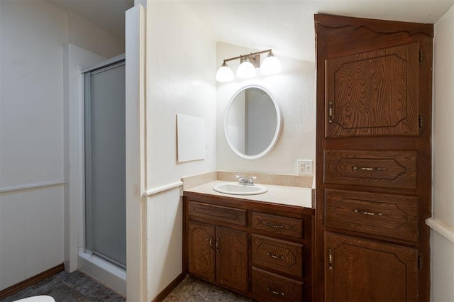 bathroom with vanity and a shower with shower door